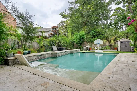 a view of swimming pool with chairs