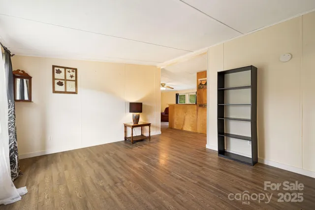 a view of a livingroom with furniture and wooden floor