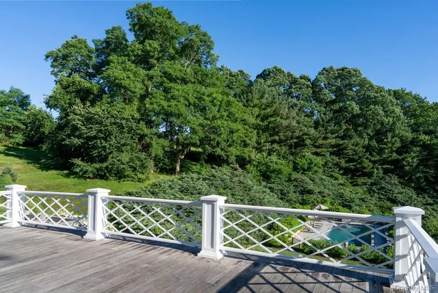 a view of a wooden fence and trees