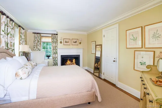 a spacious bedroom with a bed and a large window