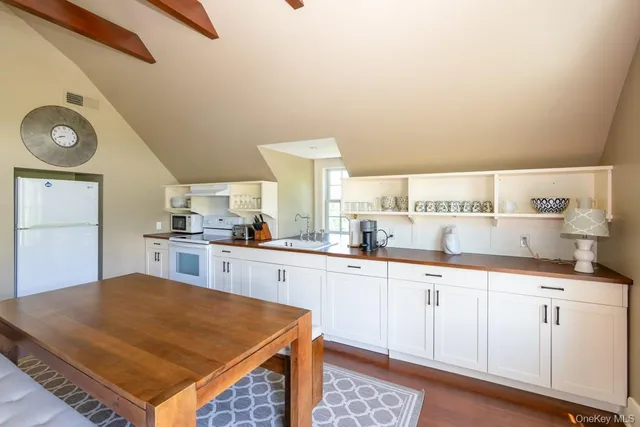 a kitchen with cabinets and window