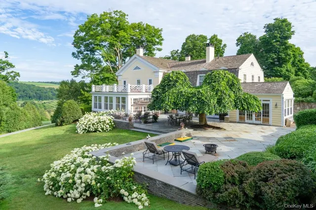 a view of a house with garden and a garden