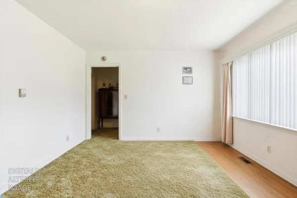 a bathroom with a toilet and shower
