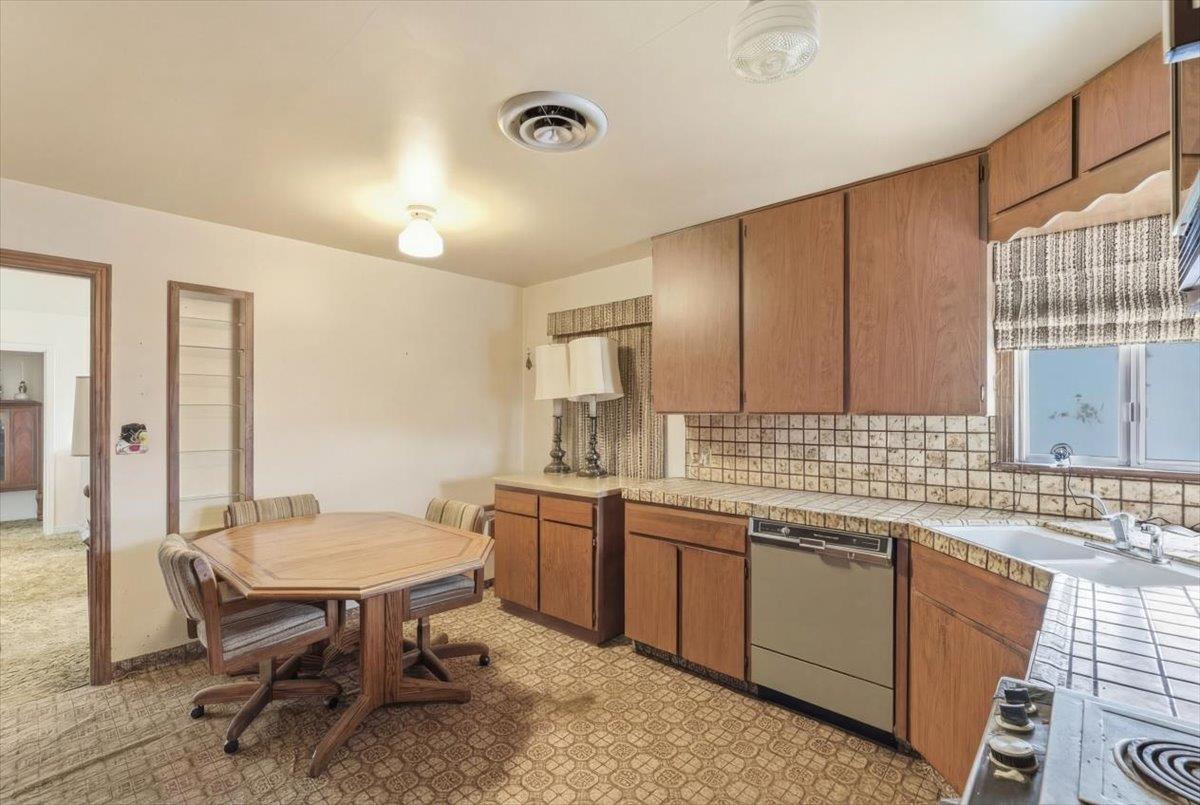 1833 Richard Way Ceres, CA 95307 - Photo 8 of 21 a kitchen with a sink cabinets and wooden floor