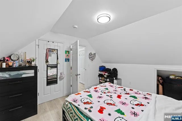 a bedroom with a bed and dresser