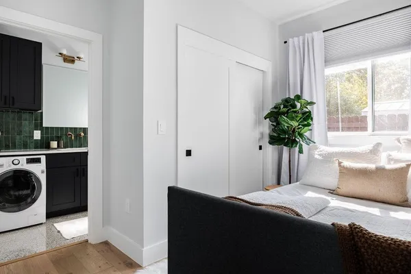 a bedroom with a bed and a window