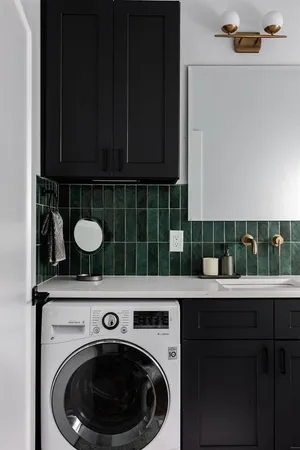 a kitchen with a sink a washer and dryer