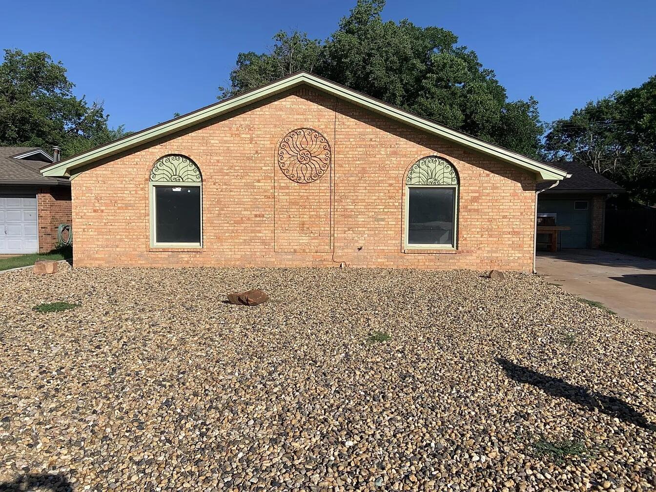4120 62nd Drive Lubbock, TX 79413 - Photo 1 of 19 a front view of a house with a yard