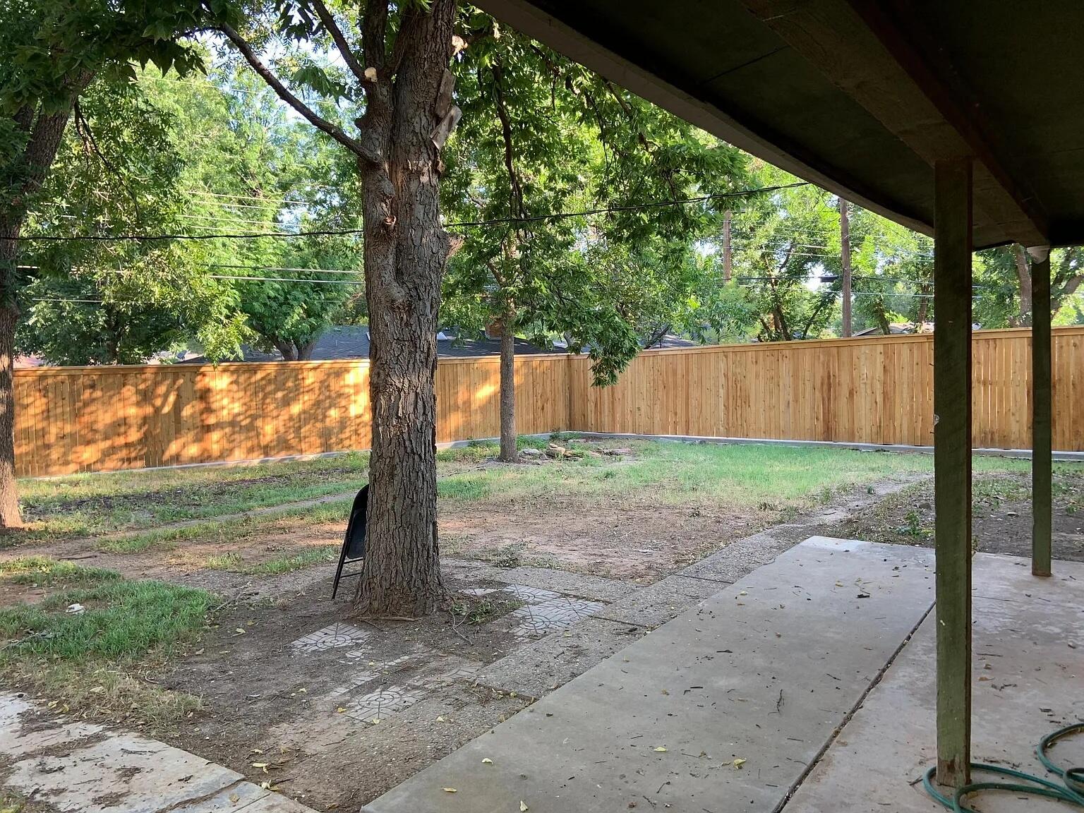 4120 62nd Drive Lubbock, TX 79413 - Photo 19 of 19 a view of a yard with tree s