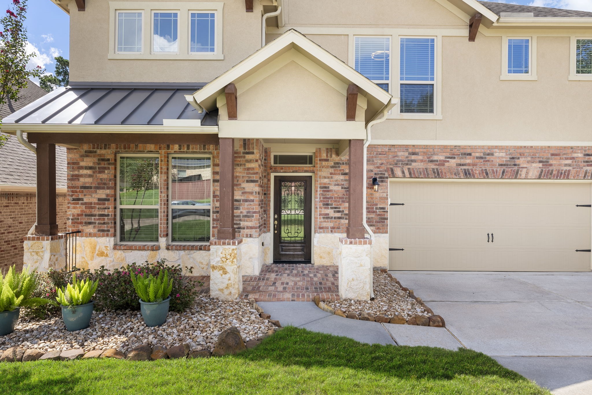 3565 Falcon Way Conroe, TX 77304 - Photo 4 of 50 Covered front entry featuring brick and stone exterior details.