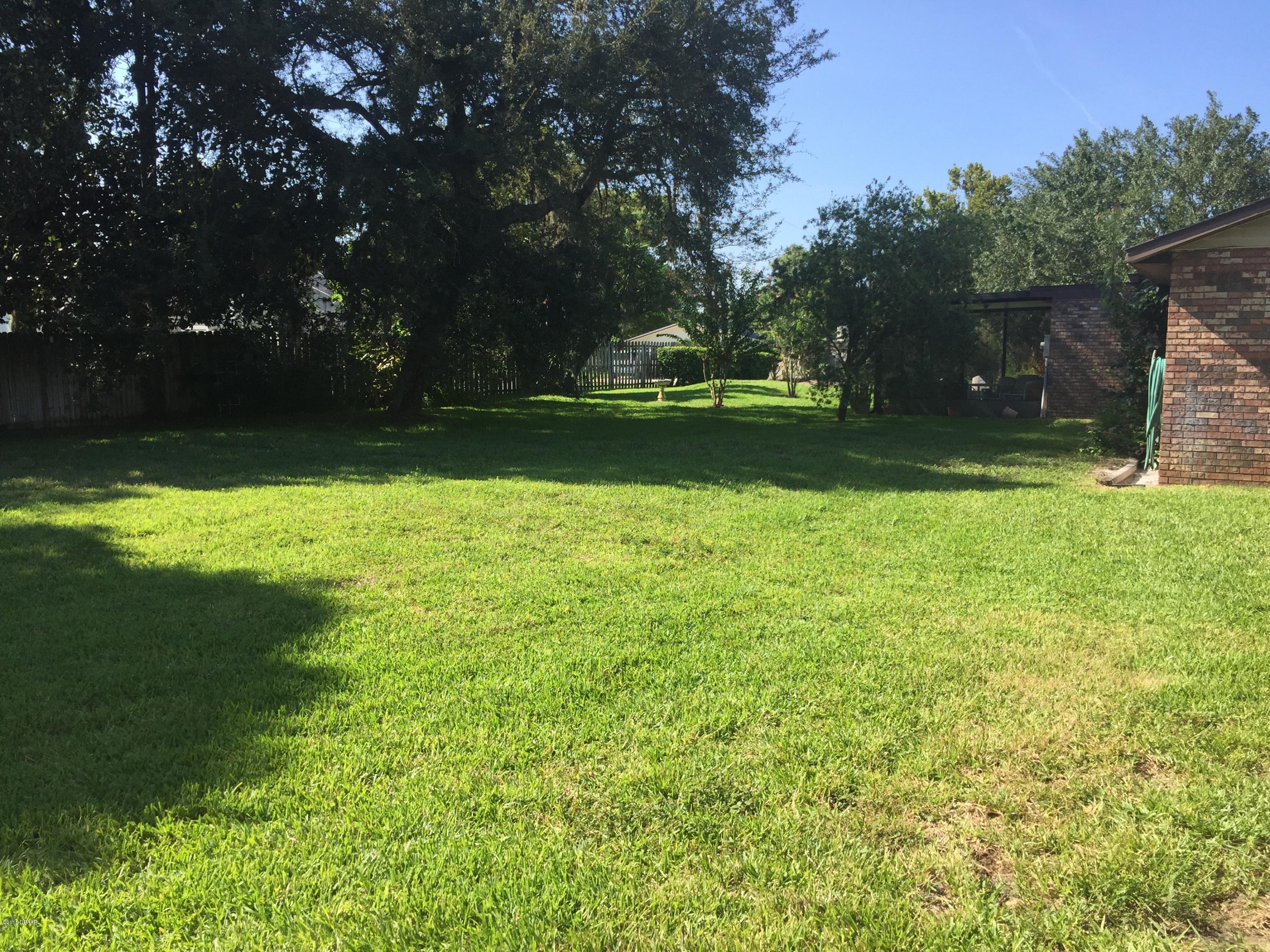 18 Mayfield Terrace Ormond Beach, FL 32174 - Photo 15 of 17 a view of a golf course with a lake
