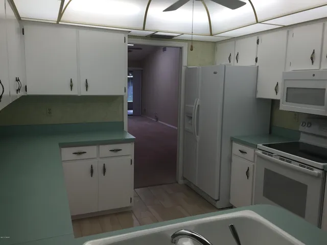 a view of a room with a fan