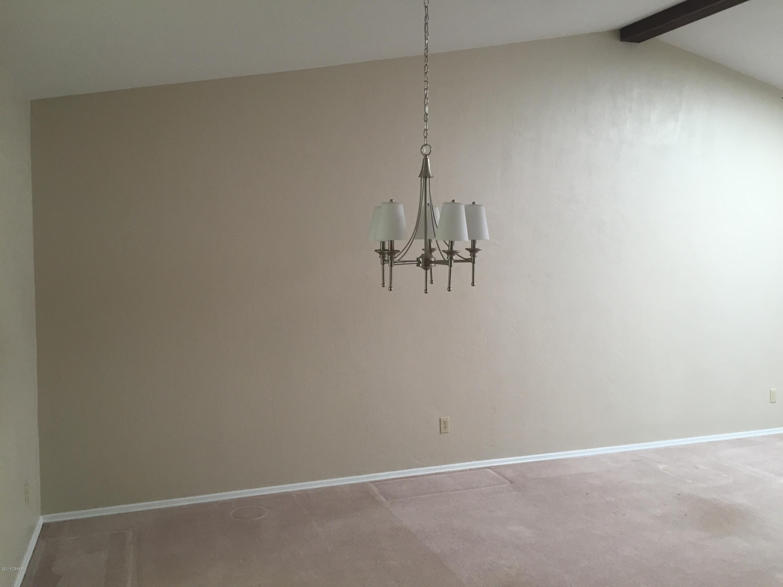 18 Mayfield Terrace Ormond Beach, FL 32174 - Photo 5 of 17 a view of a room with a fan