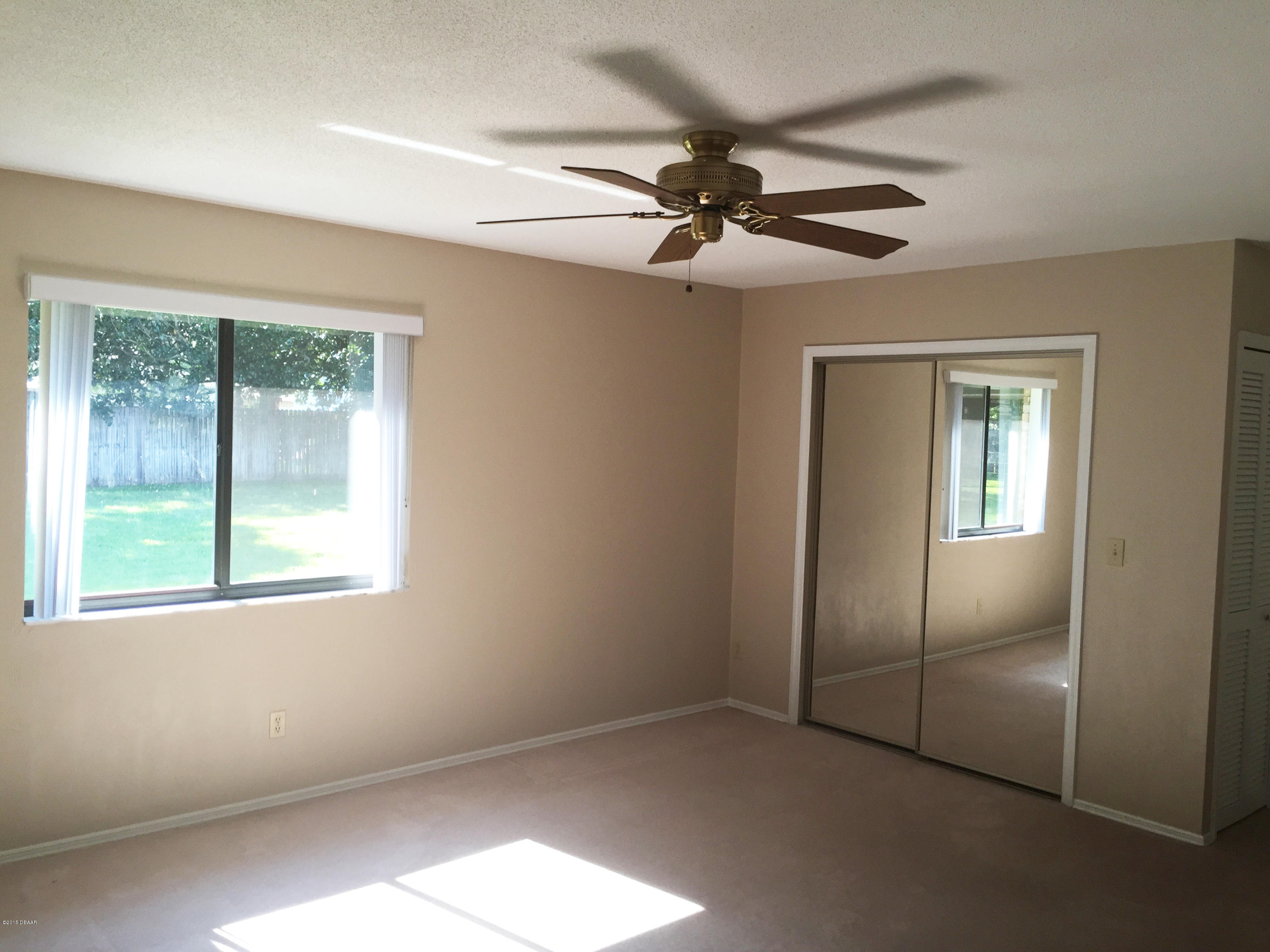18 Mayfield Terrace Ormond Beach, FL 32174 - Photo 6 of 17 a view of an empty room with a window