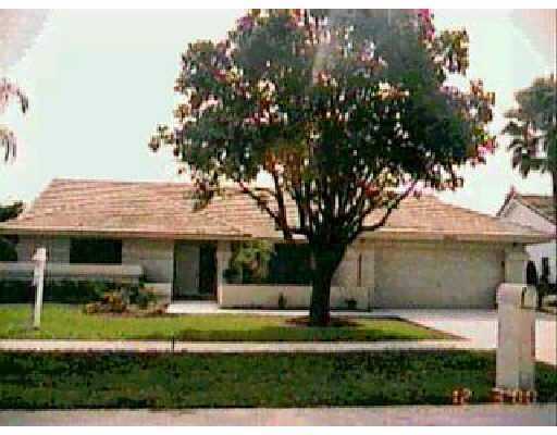 9557 El Clair Ranch Road Boynton Beach, FL 33437 - Photo 1 of 1 a front view of a house with a yard