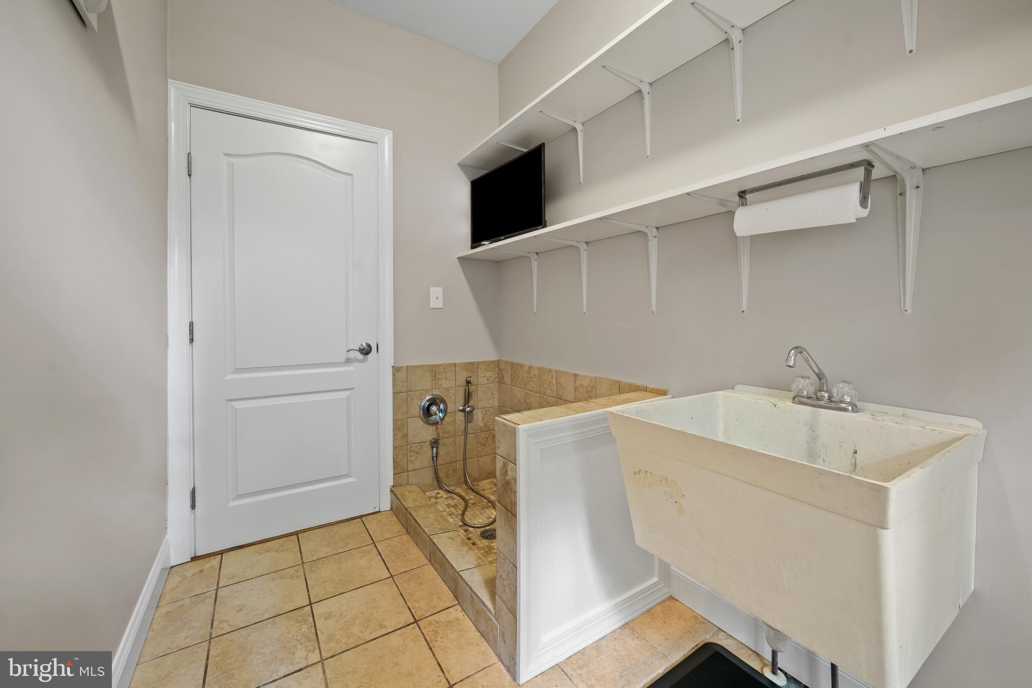 12221 Jerusalem Road Kingsville, MD 21087 - Photo 46 of 66 Mud Room w/dog shower and a 2nd Laundry Hookup