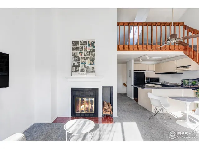a open kitchen with granite countertop a stove top oven a sink and dishwasher