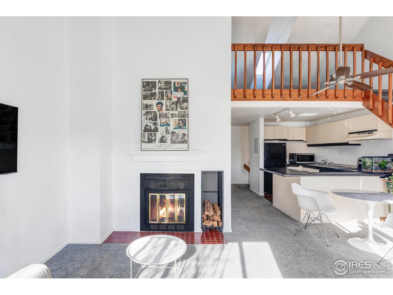 2201 Pearl Street, Unit 224 Boulder, CO 80302 - Photo 9 of 19 A warm wood staircase leads to an open loft-an ideal versatile space for an office, lounge, or potential second bedroom.