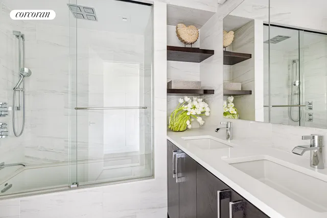 a bathroom with a sink and a shower