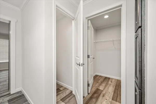 a view of a bathroom from a corridor