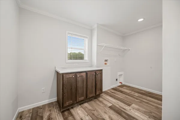 a view of a storage & utility room with wooden floor