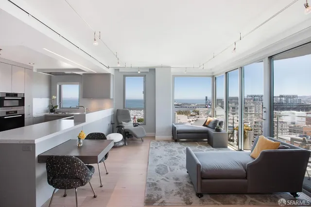 a living room with furniture or couch and a large window