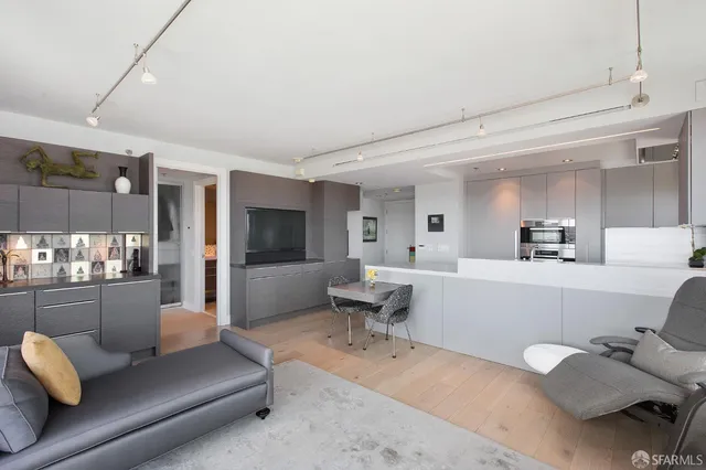 a living room with furniture and view of living room