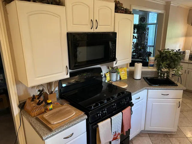 a kitchen with a stove and a microwave