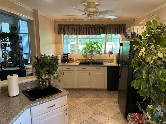 a kitchen with a sink and cabinets