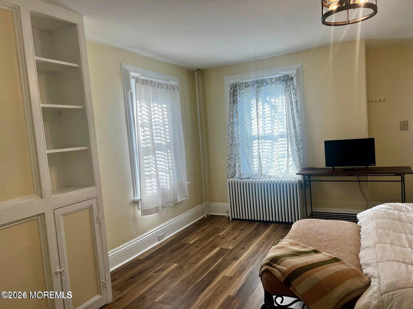 27 Spring Street Freehold, NJ 07728 - Photo 13 of 40 a living room with furniture and a window