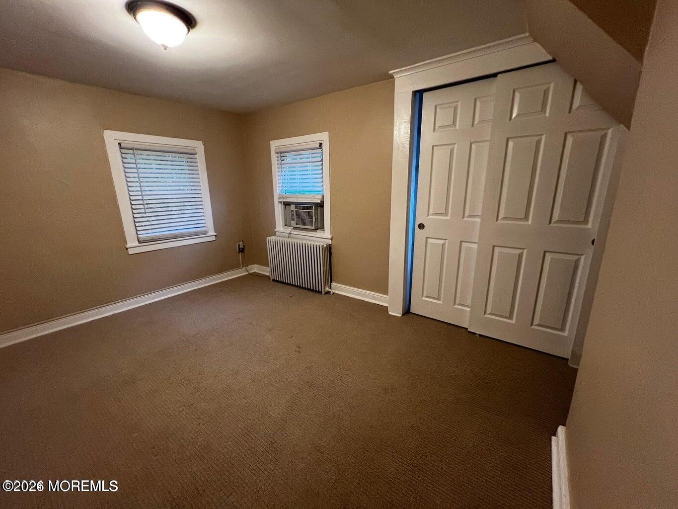27 Spring Street Freehold, NJ 07728 - Photo 17 of 40 an empty room with windows