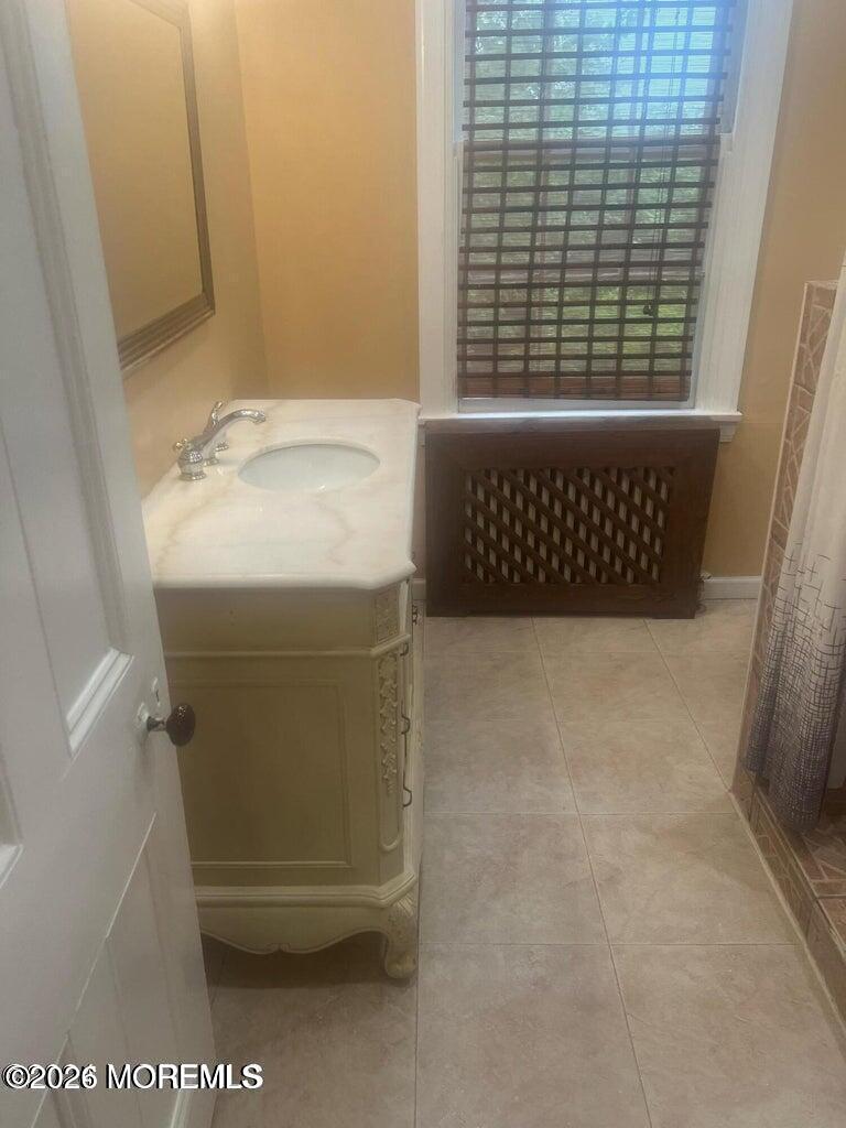 27 Spring Street Freehold, NJ 07728 - Photo 37 of 40 a bathroom with a bathtub