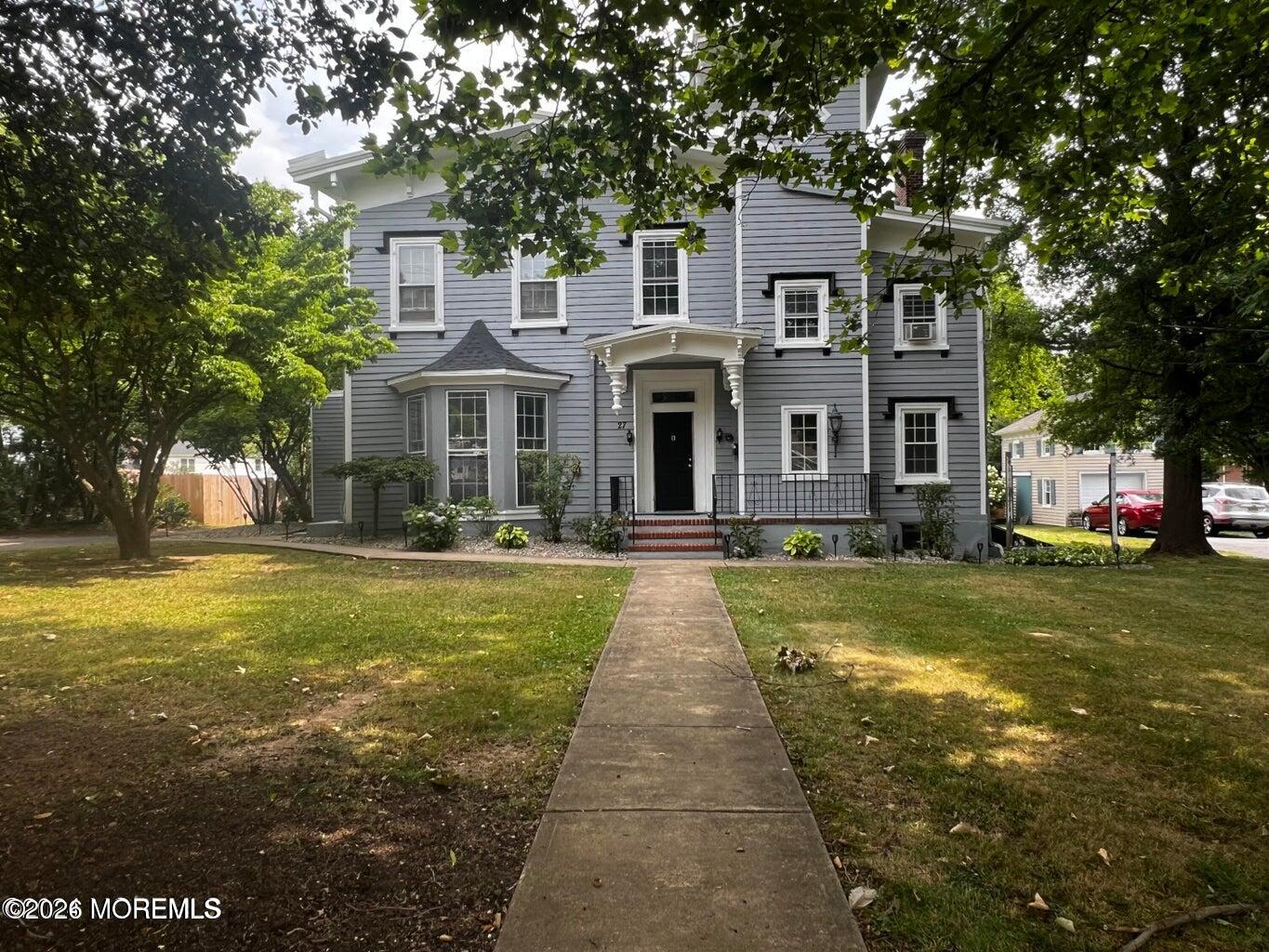27 Spring Street Freehold, NJ 07728 - Photo 40 of 40 a front view of a house with swimming pool and porch