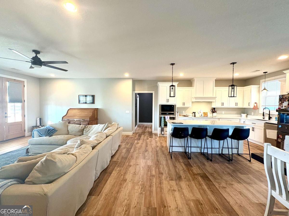 134 Austin Way Vidalia, GA 30474 - Photo 16 of 41 a living room with furniture and a wooden floor