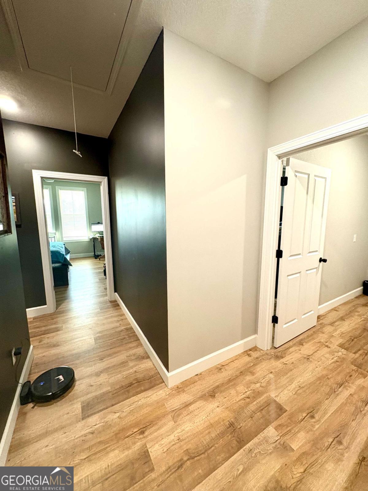 134 Austin Way Vidalia, GA 30474 - Photo 39 of 41 a view of a hallway with wooden floor and a bathroom