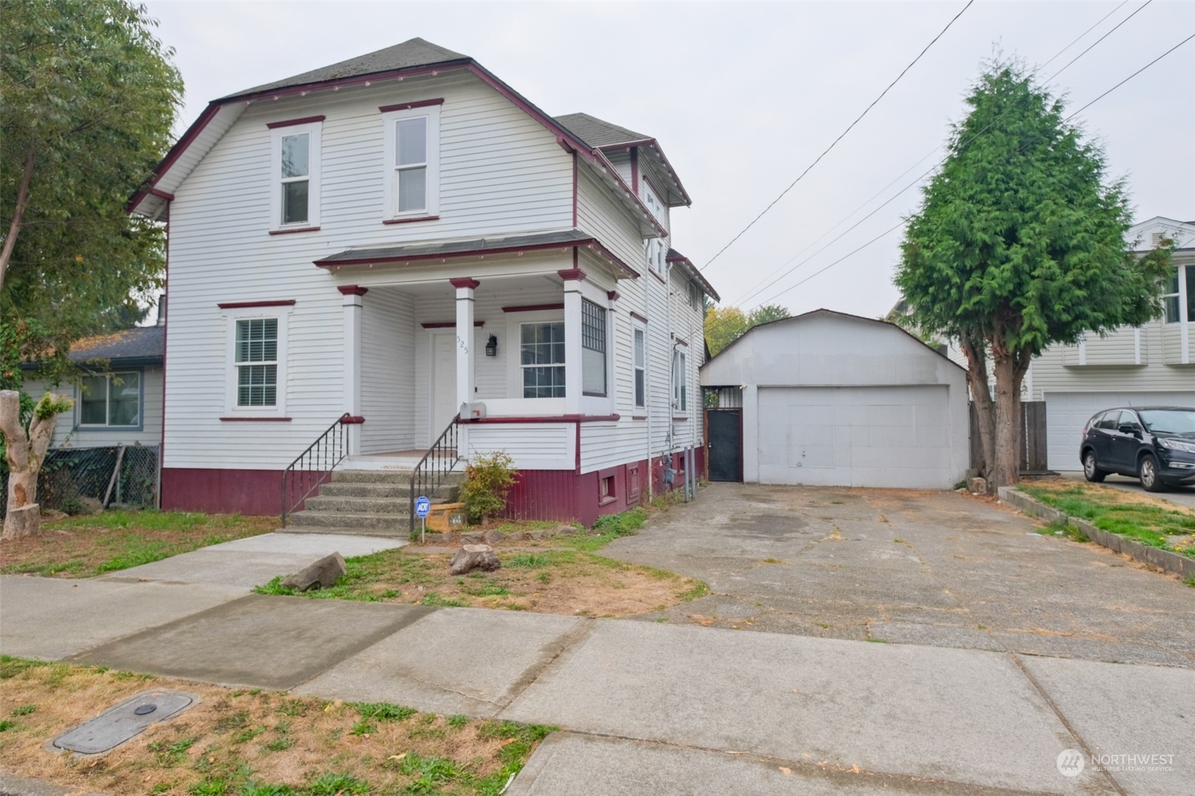 525 Wells Avenue South Renton, WA 98057 - Photo 1 of 25 a front view of a house with a yard and garage
