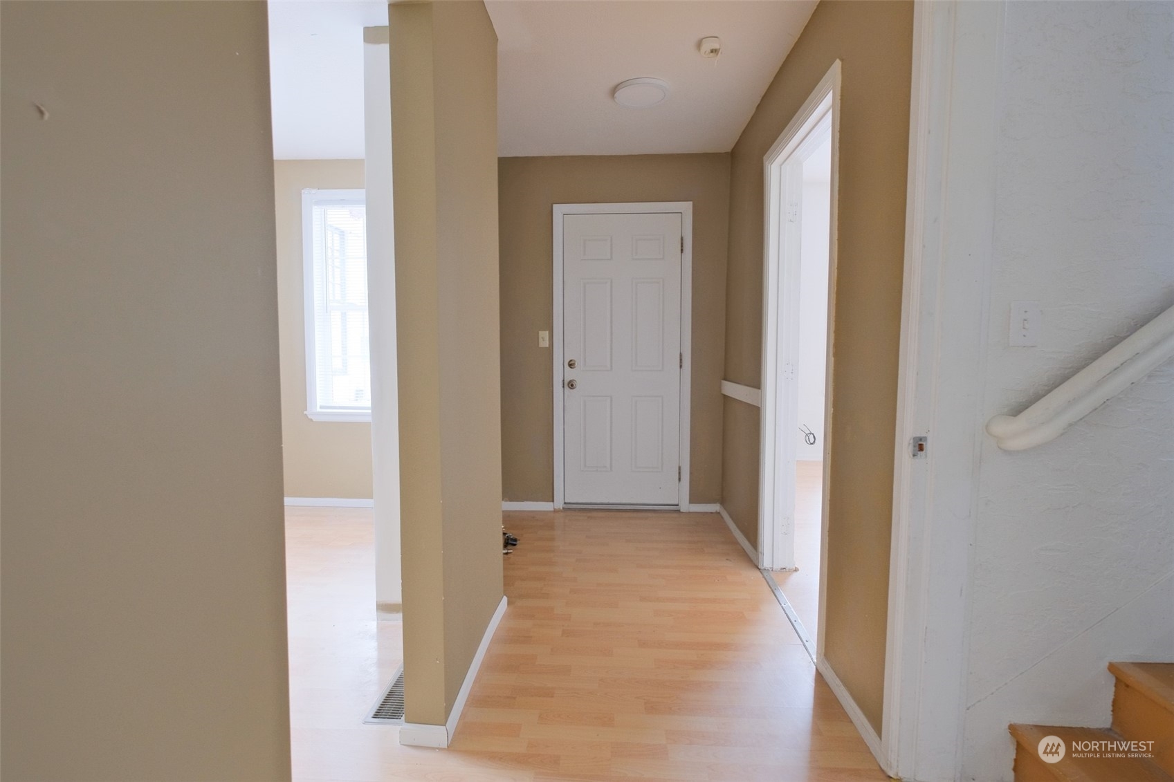 525 Wells Avenue South Renton, WA 98057 - Photo 4 of 25 a view of a hallway with wooden floor