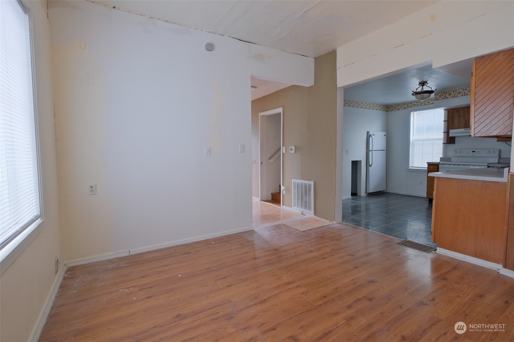 525 Wells Avenue South Renton, WA 98057 - Photo 8 of 25 a view of a kitchen with a stove wooden floor and a window