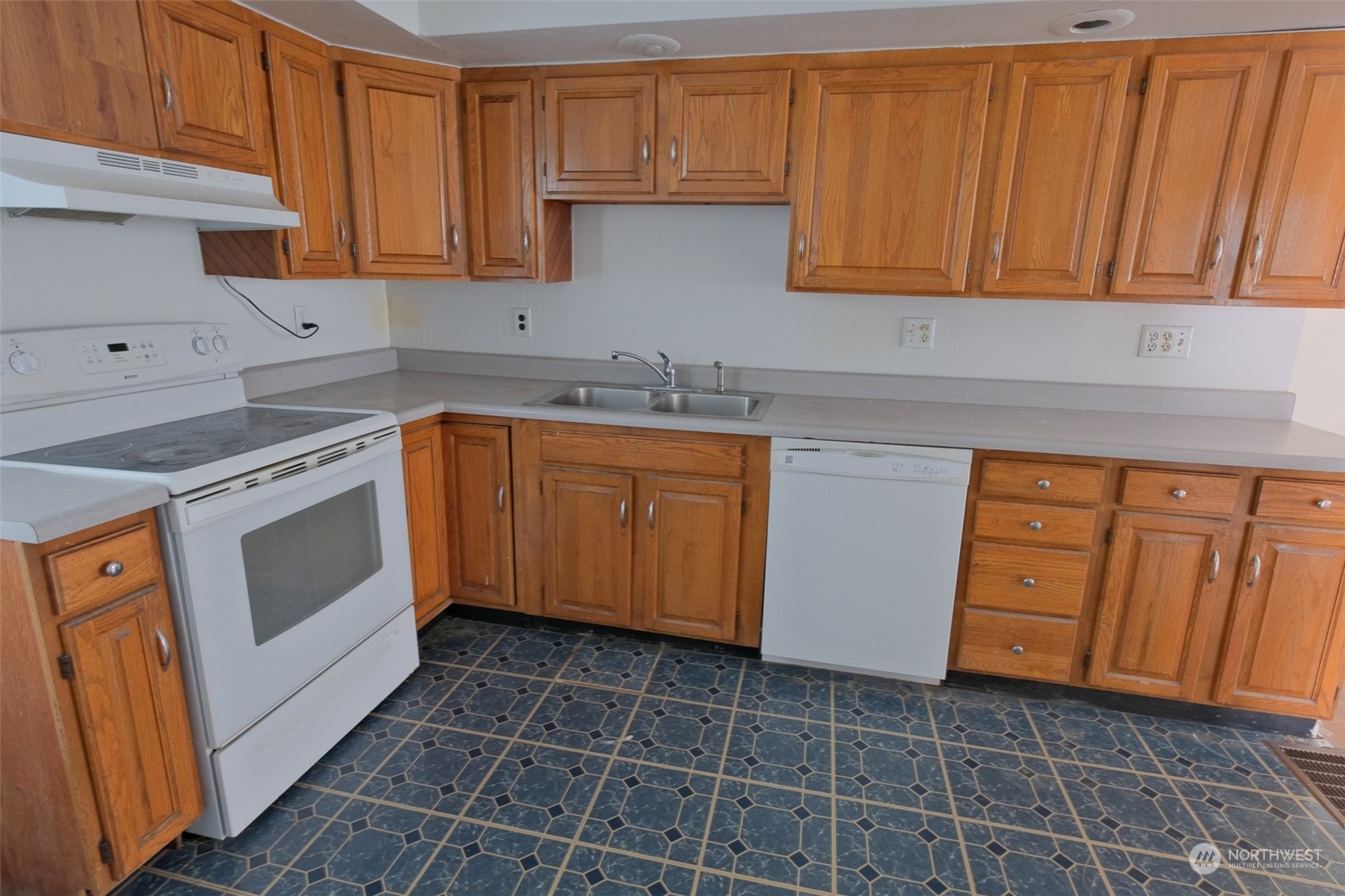 525 Wells Avenue South Renton, WA 98057 - Photo 10 of 25 a kitchen with stainless steel appliances granite countertop a sink stove and cabinets