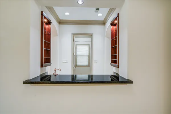 a kitchen with stainless steel appliances granite countertop a stove and a refrigerator