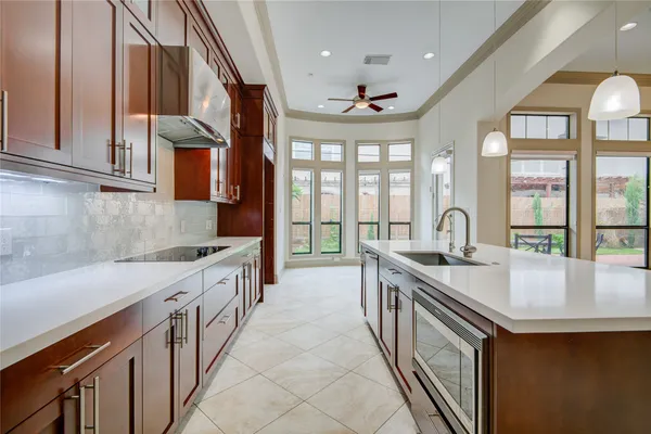 a kitchen with stainless steel appliances granite countertop a sink and cabinets