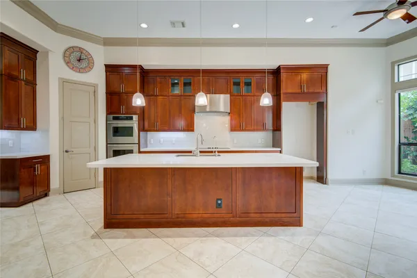 a kitchen with stainless steel appliances granite countertop a stove and a refrigerator