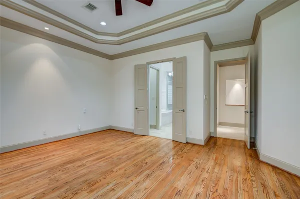 a view of a livingroom with a ceiling fan and window