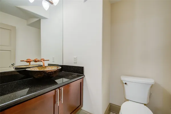 a view of a hallway with wooden floor and stairs