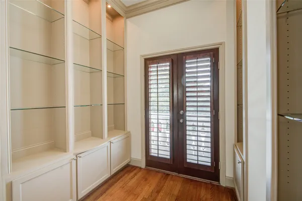 a view of an empty room and a window