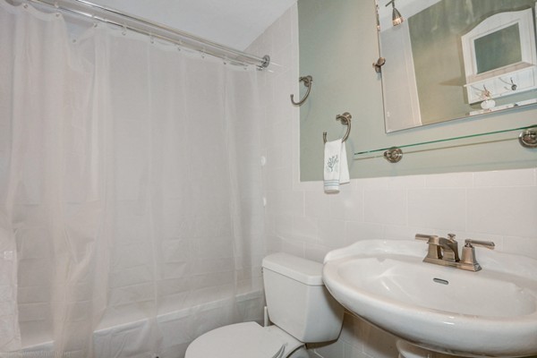 4 Abbott Road Natick, MA 01760 - Photo 16 of 30 a bathroom with a sink and a mirror