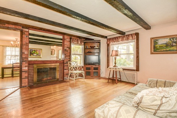 4 Abbott Road Natick, MA 01760 - Photo 4 of 30 a bedroom with a bed and a fireplace