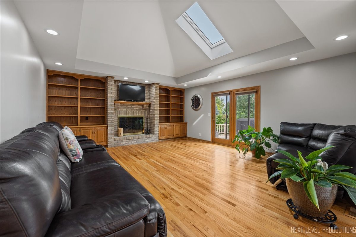 905 Merrill New Road Sugar Grove, IL 60554 - Photo 16 of 44 a living room with furniture and a fireplace