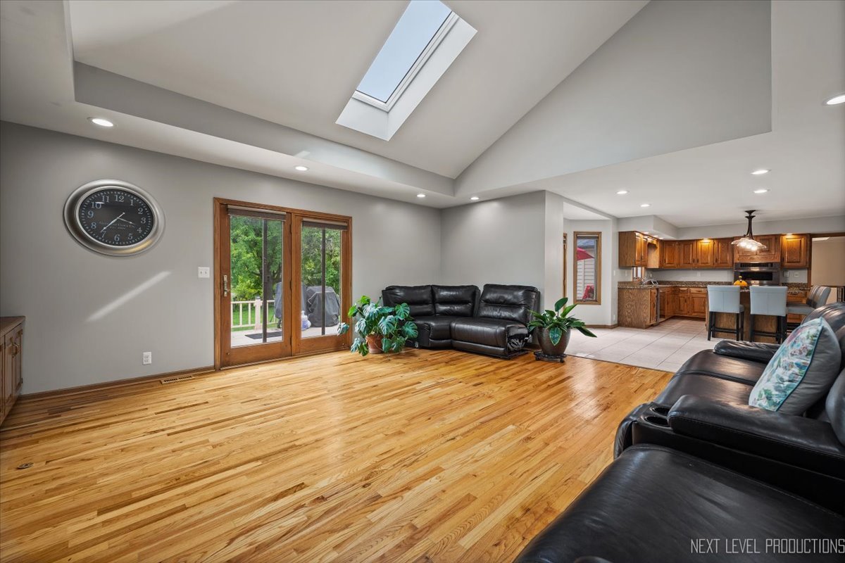 905 Merrill New Road Sugar Grove, IL 60554 - Photo 17 of 44 a living room with furniture and a wooden floor