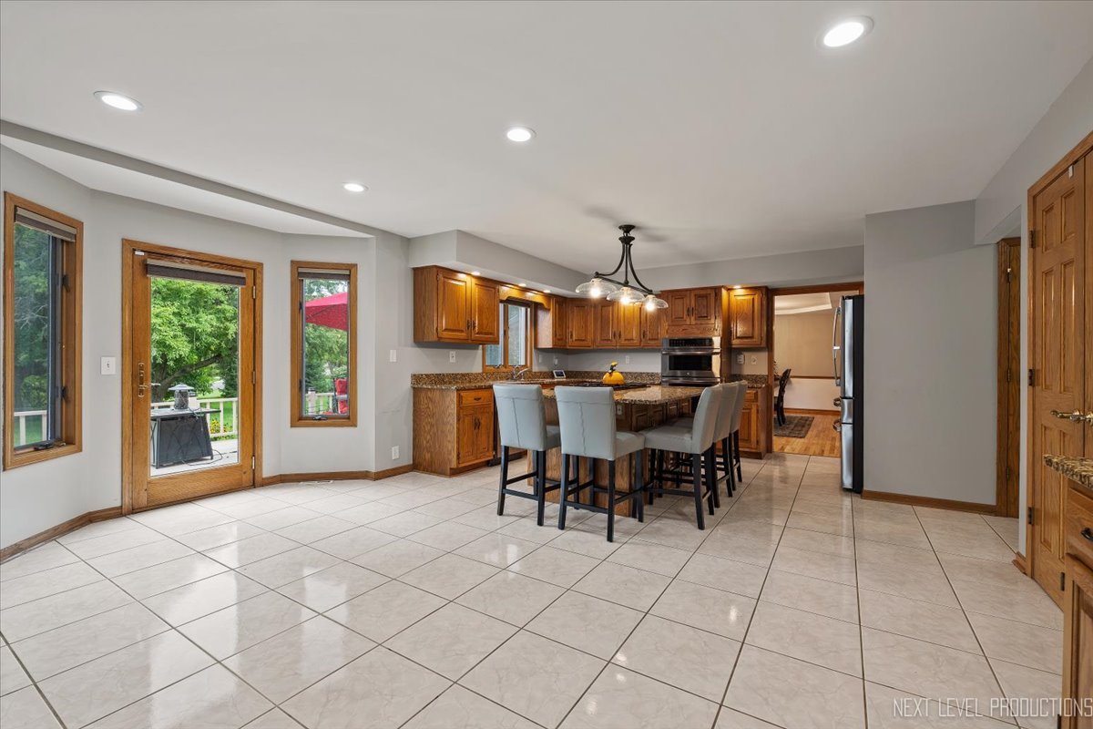905 Merrill New Road Sugar Grove, IL 60554 - Photo 18 of 44 a view of a kitchen and dining room